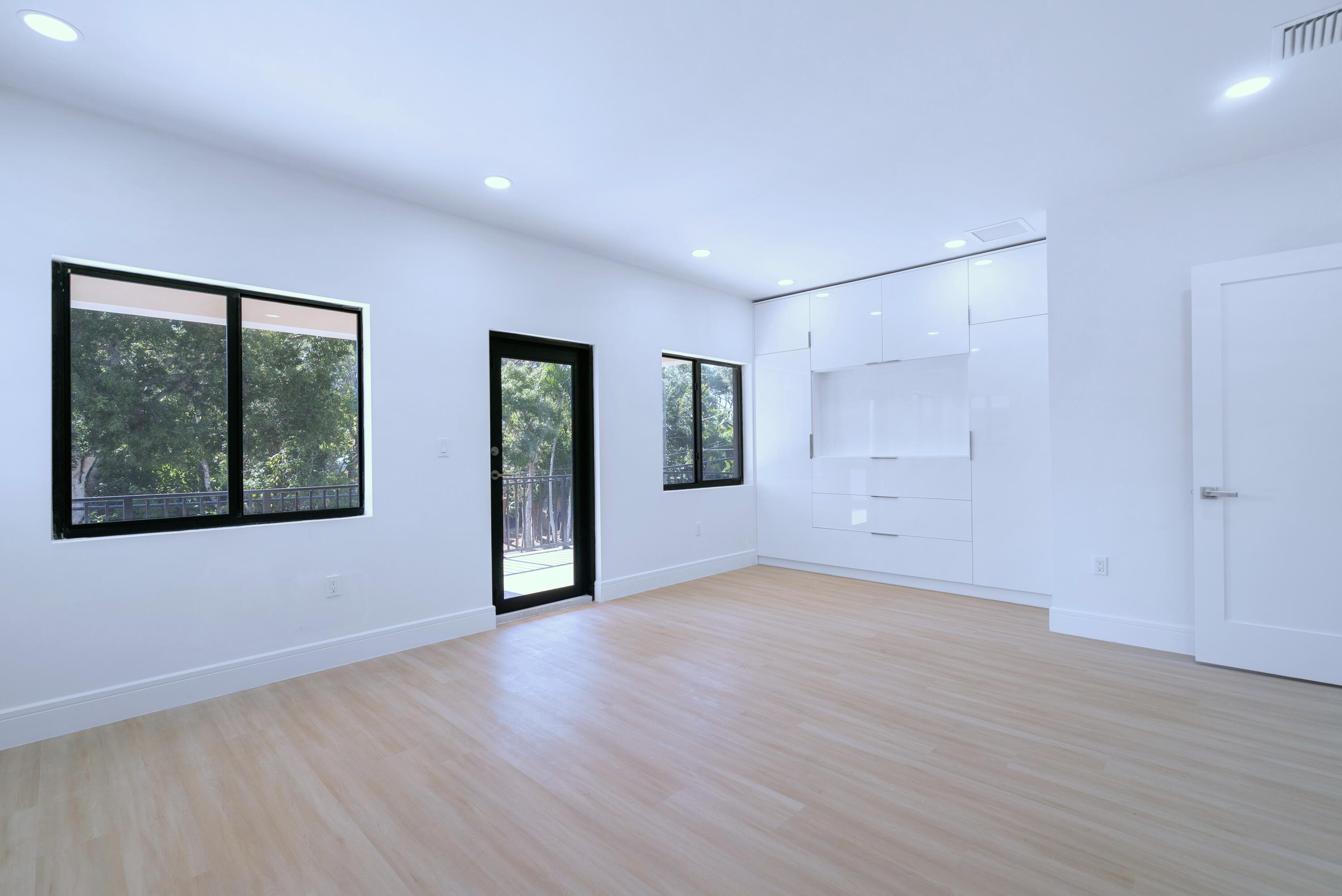17 Coral Way Key Largo, FL 33037 - Photo 35 of 51 a view of an empty room with wooden floor and windows