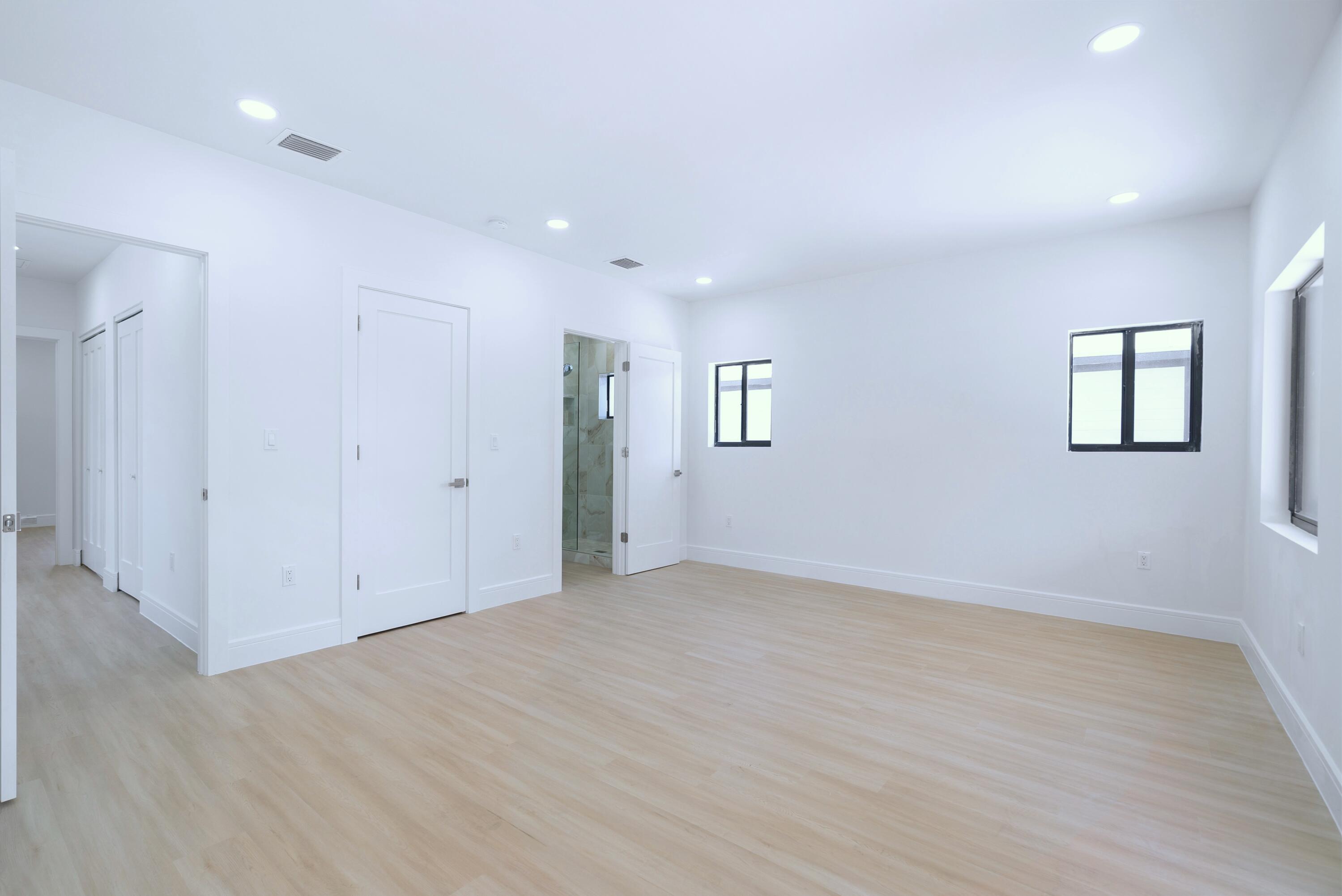 17 Coral Way Key Largo, FL 33037 - Photo 36 of 51 an empty room with wooden floor and windows