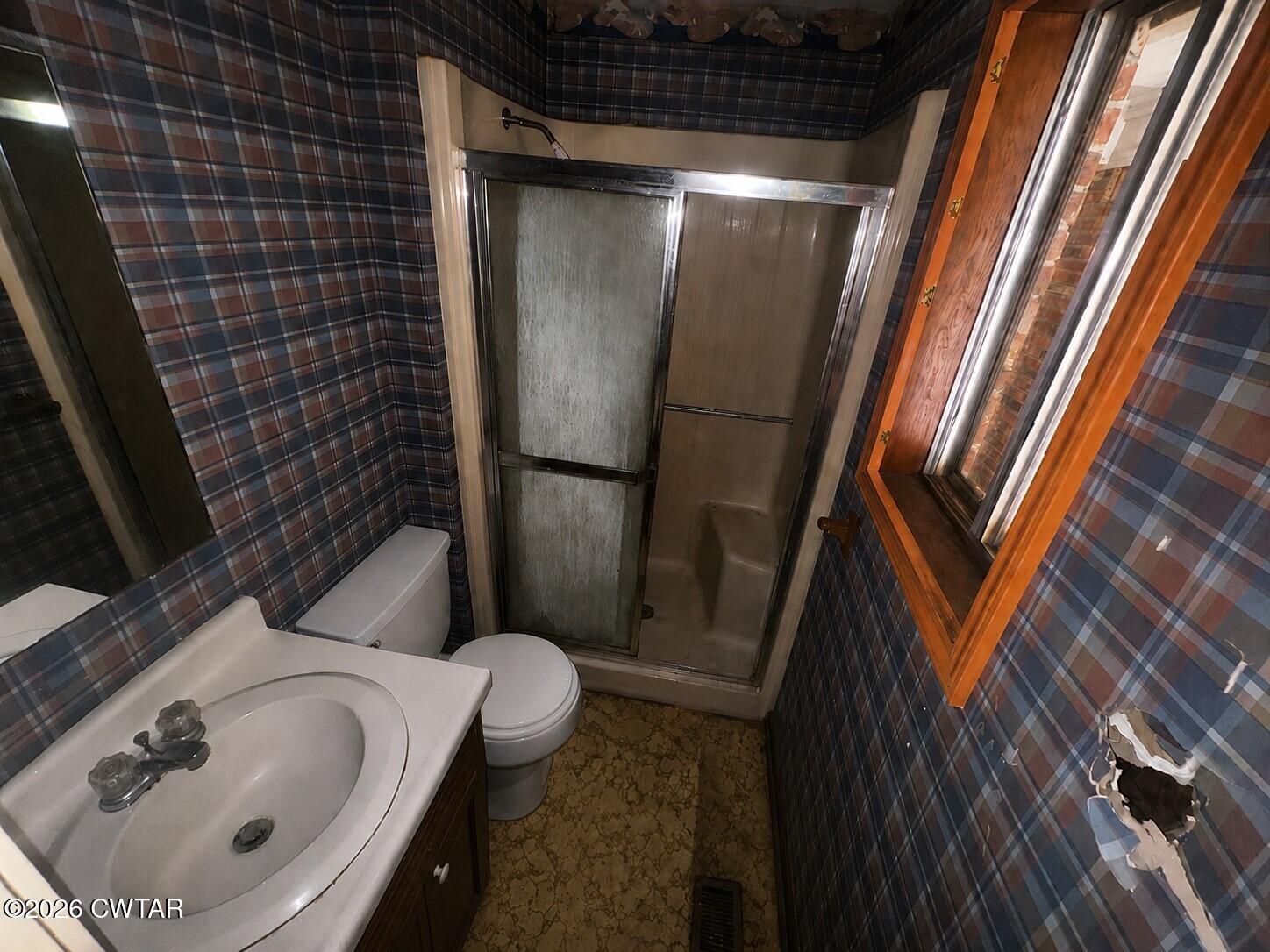 1400 Roper Road Bolivar, TN 38008 - Photo 14 of 23 a bathroom with a sink and toilet