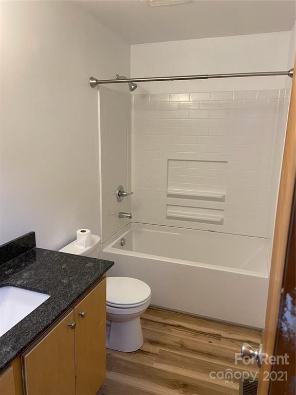 107 Keeter Street Grover, NC 28073 - Photo 5 of 9 a bathroom with a granite countertop sink toilet and shower