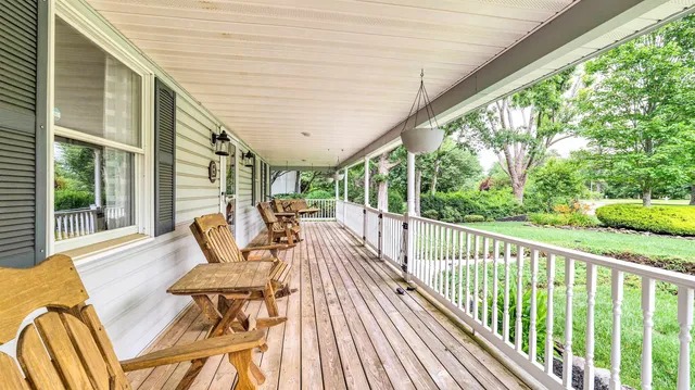 a view of balcony with furniture and wooden deck