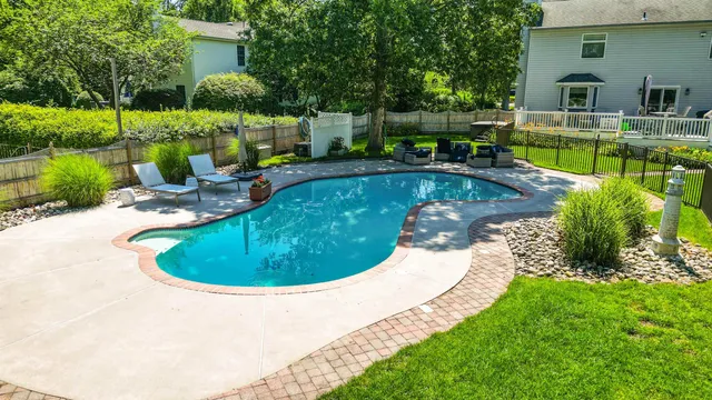 a view of a swimming pool with a patio