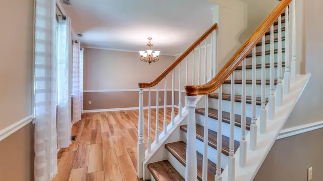 a view of staircase with wooden floor and staircase