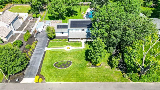 aerial view of a house with a swimming pool