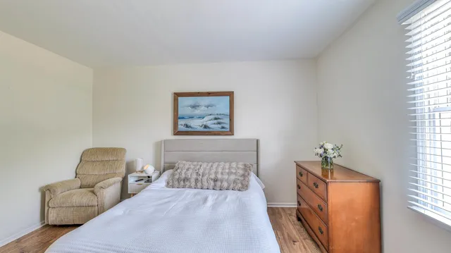 a bedroom with a bed and a couch