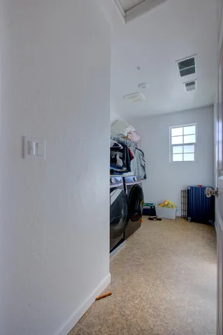 a bed room with furniture and a closet