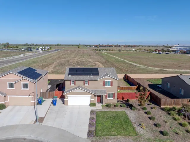 an aerial view of a house with a outdoor space