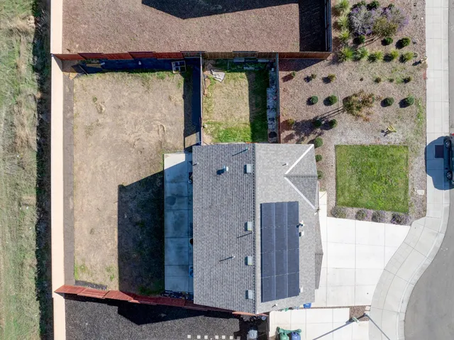 aerial view of a house with a tub and balcony