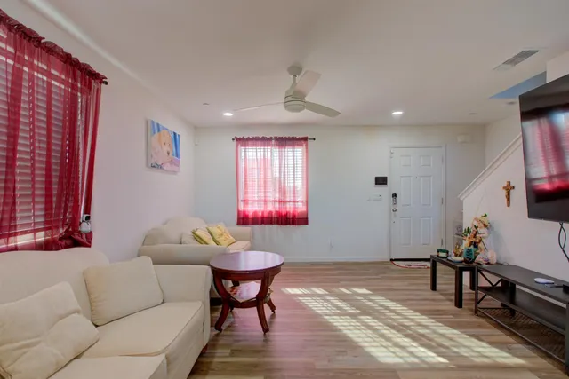 a living room with furniture and a window