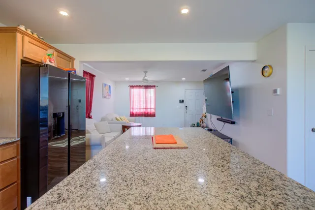 a room with furniture and a flat screen tv