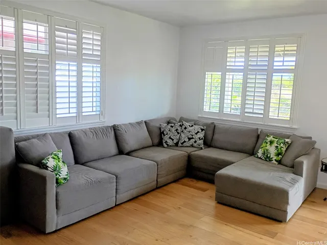 a living room with furniture and windows