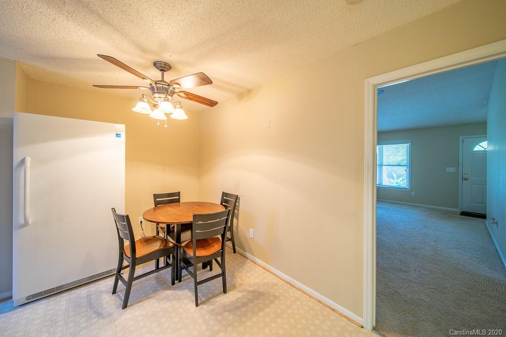 4525 Hickory Grove Road Sharon, SC 29742 - Photo 11 of 35 a view of a dining room with furniture and a chandelier fan
