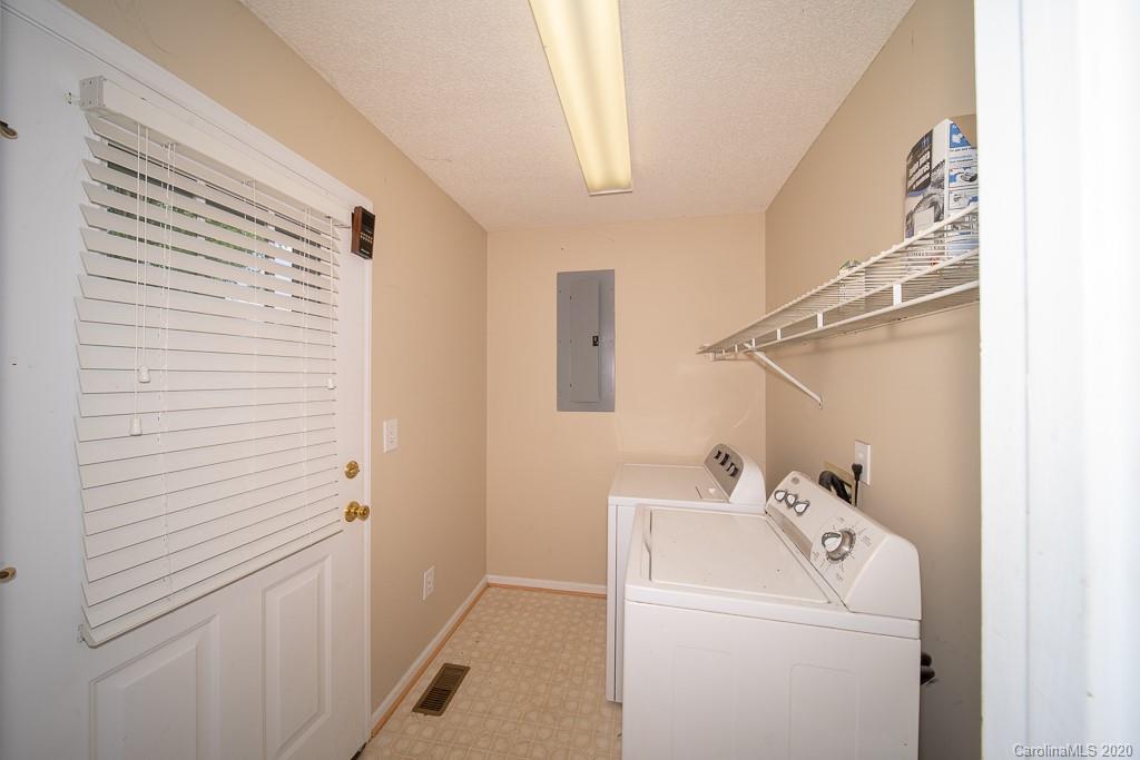 4525 Hickory Grove Road Sharon, SC 29742 - Photo 12 of 35 a bathroom with a sink and a washer and dryer