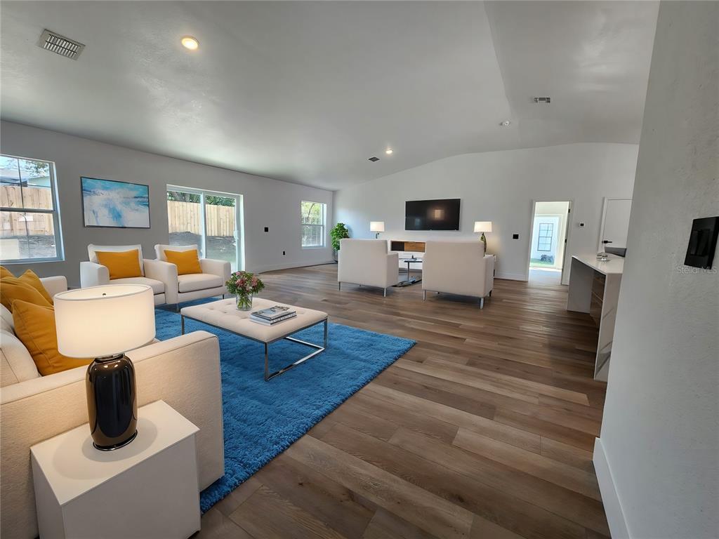 1032 Concert Avenue Spring Hill, FL 34609 - Photo 20 of 35 a living room with furniture and wooden floor