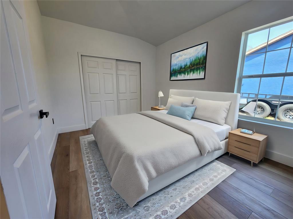 1032 Concert Avenue Spring Hill, FL 34609 - Photo 21 of 35 a bedroom with bed and window