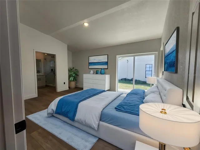 a bedroom with a bed and a couch