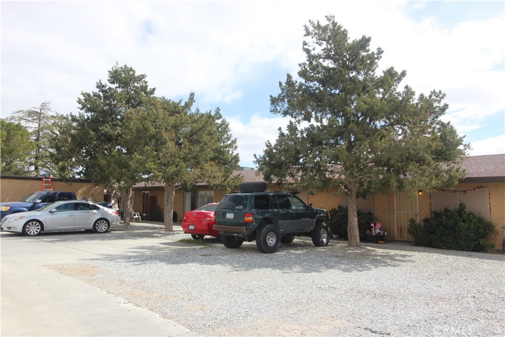 15761 Serrano Road Apple Valley, CA 92307 - Photo 1 of 1 a view of street with parked cars