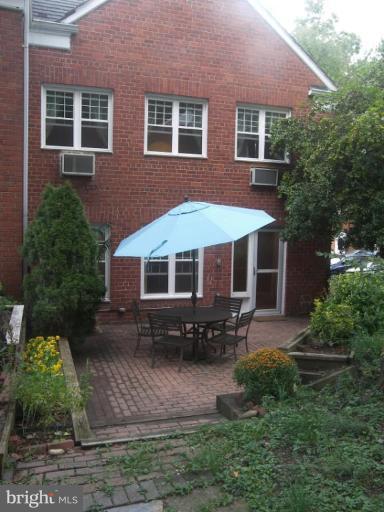3648 Gunston Road Alexandria, VA 22302 - Photo 1 of 12 a front view of a house with a yard
