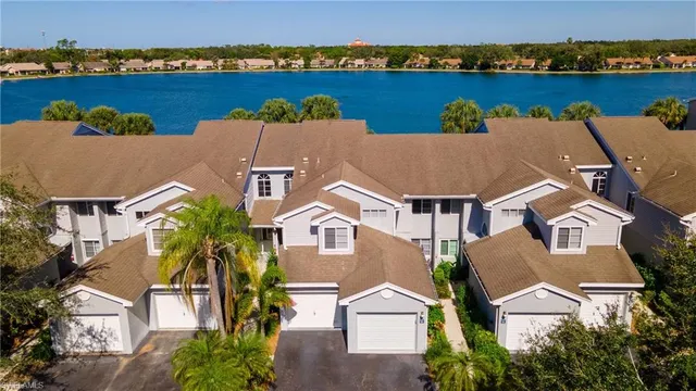 an aerial view of a house with a lake view
