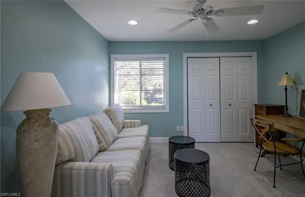 a living room with furniture and a window