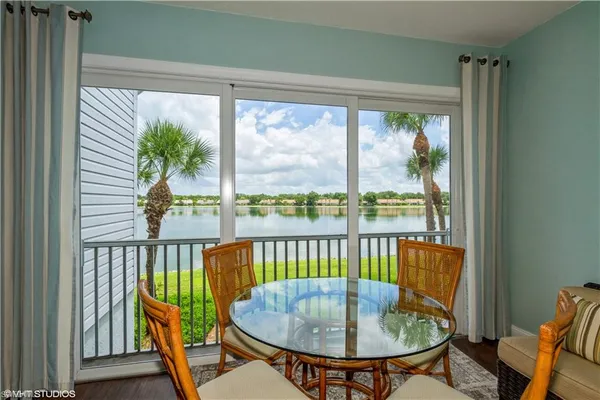 a view of a dining room with furniture window and outside view