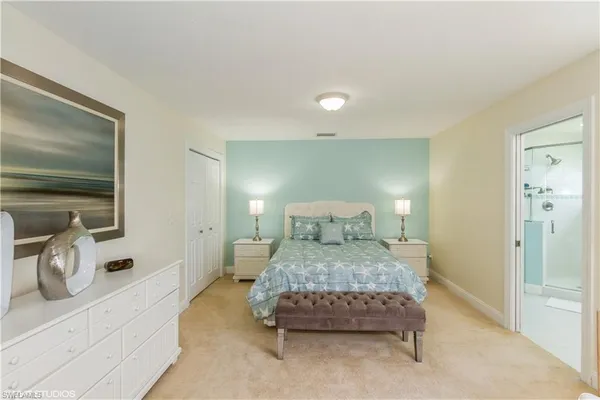 a bedroom with a bed and a view of bedroom