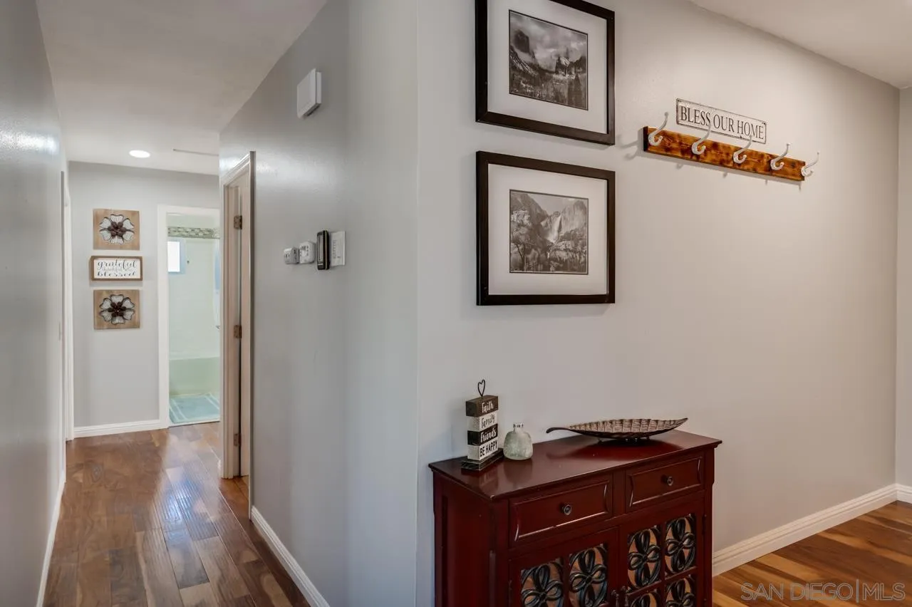 14027 Hermosillo Way Poway, CA 92064 - Photo 13 of 31 a view of a hallway with wooden floor