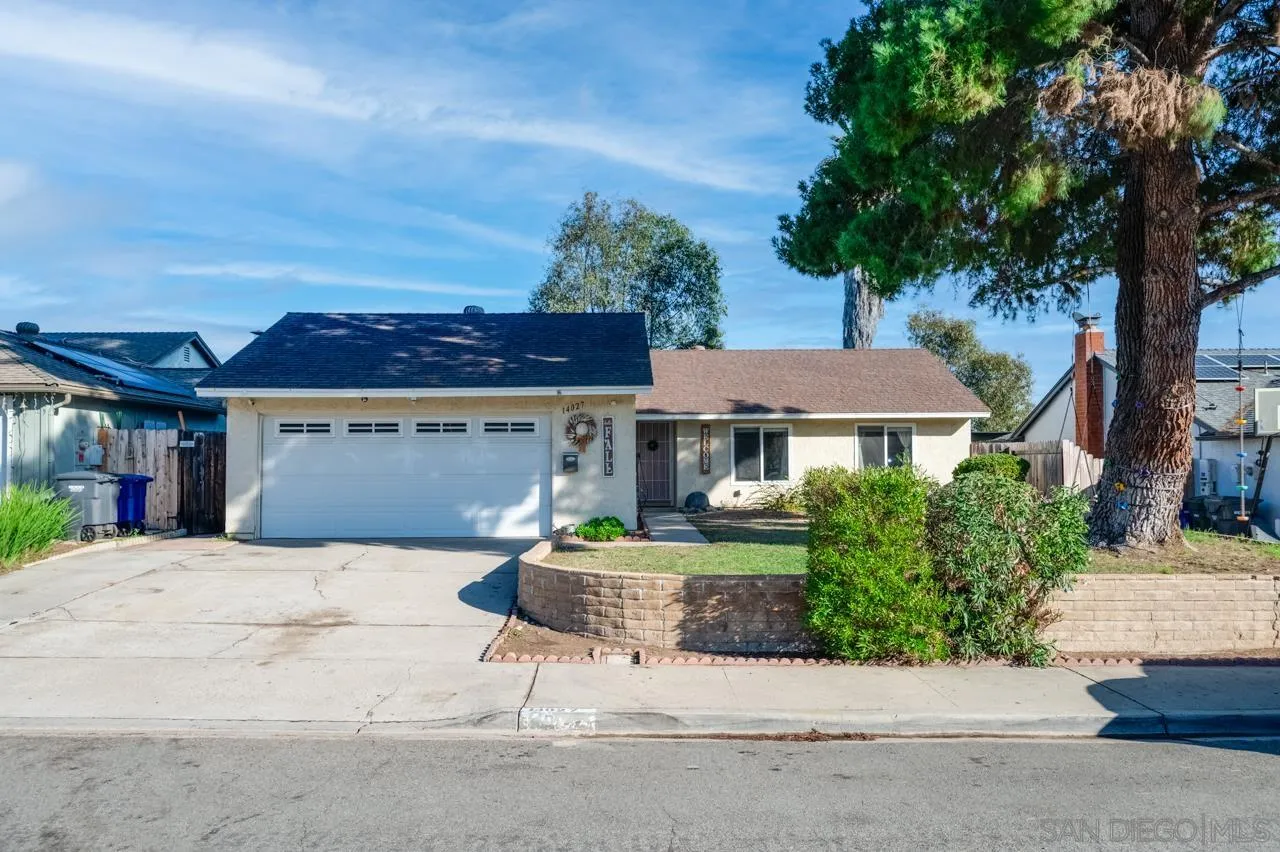 14027 Hermosillo Way Poway, CA 92064 - Photo 2 of 31 a front view of a house with a garden and a tree