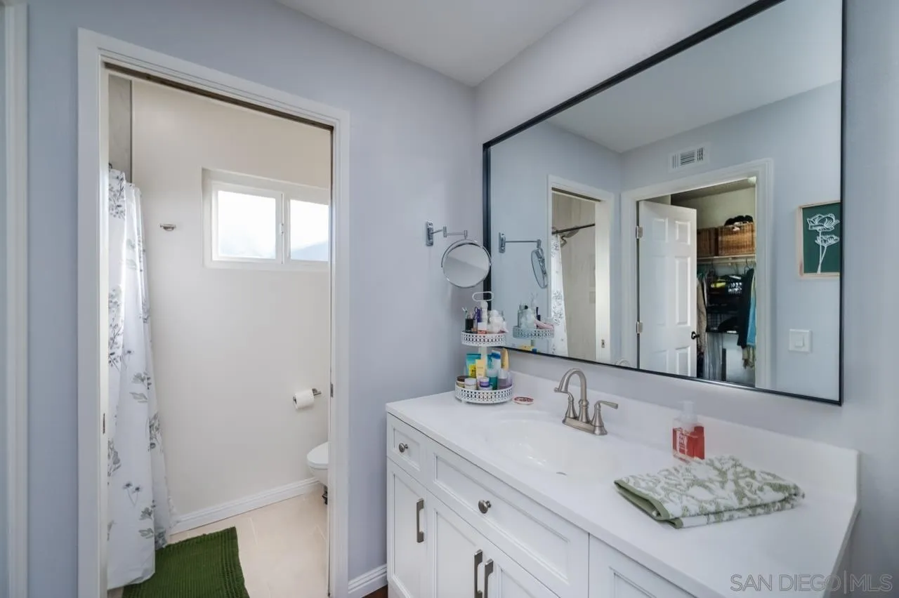 14027 Hermosillo Way Poway, CA 92064 - Photo 23 of 31 a bathroom with a sink and a mirror