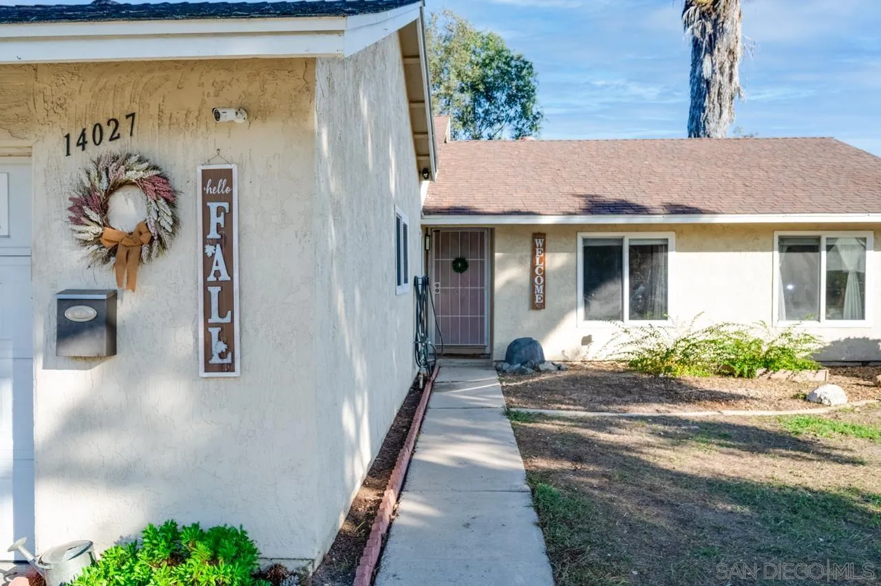 14027 Hermosillo Way Poway, CA 92064 - Photo 3 of 31 a front view of a house with garden
