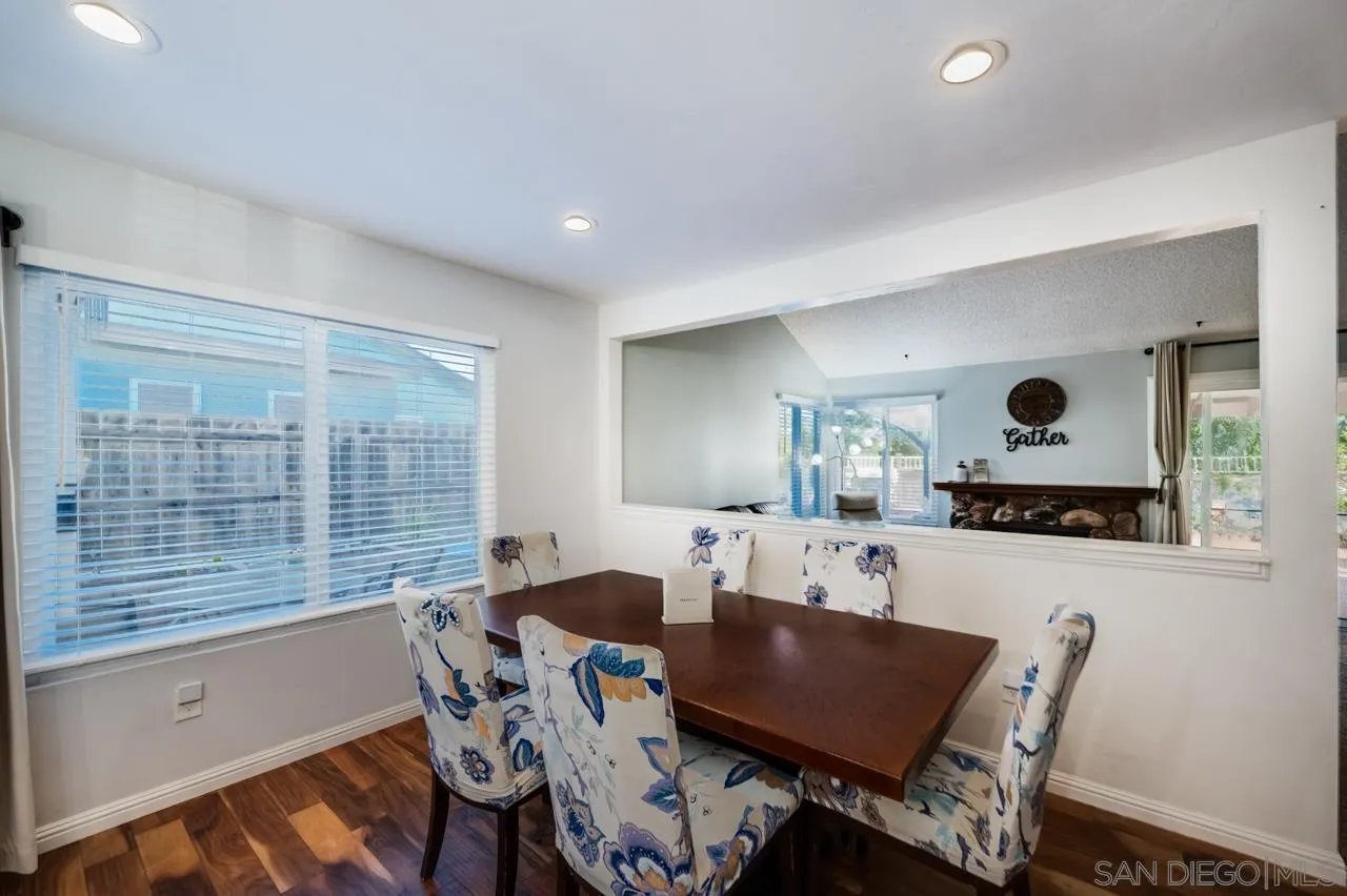 14027 Hermosillo Way Poway, CA 92064 - Photo 8 of 31 a view of a dining room with furniture and a large window