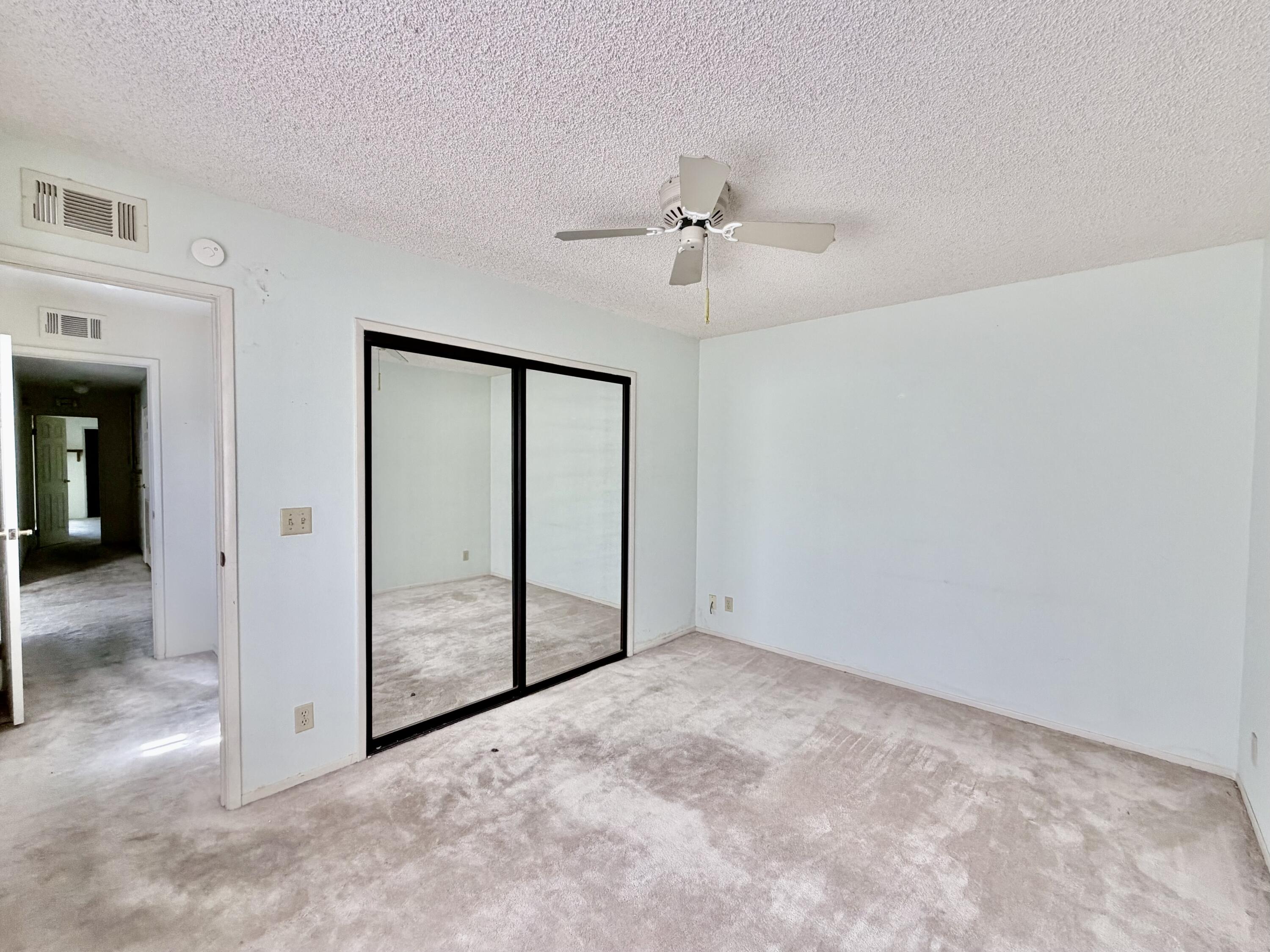 74361 Angel Camp Road Palm Desert, CA 92260 - Photo 10 of 12 an empty room with fan