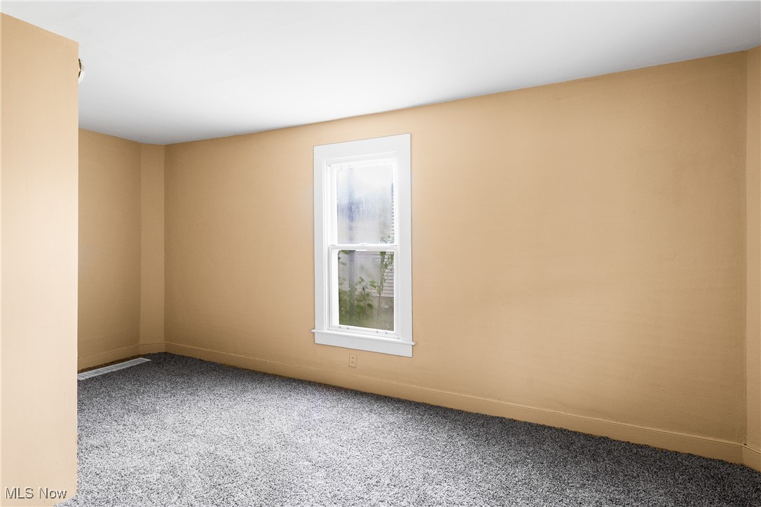 7529 State Line Burghill, OH 44404 - Photo 11 of 23 Empty room featuring carpet and baseboards
