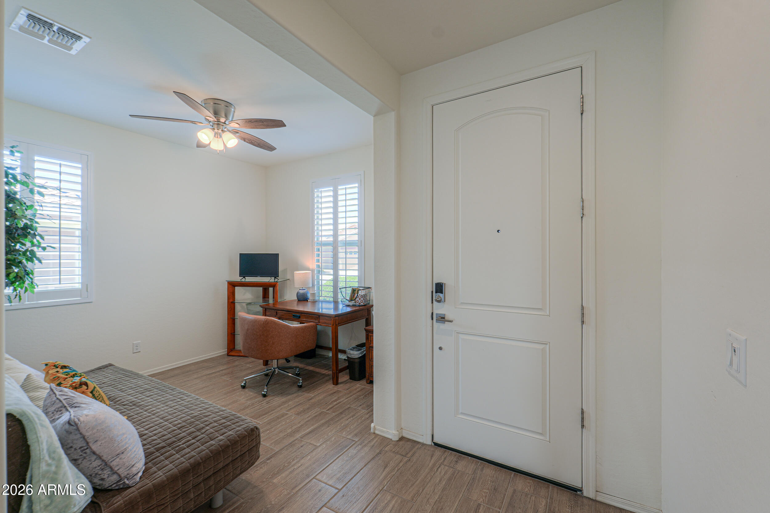 42085 West Cribbage Road Maricopa, AZ 85138 - Photo 4 of 35 a bedroom with a workspace