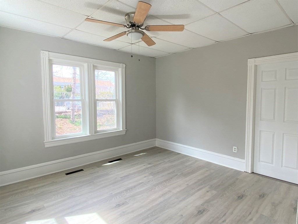 171 Snell Street Fall River, MA 02721 - Photo 15 of 34 wooden floor in an empty room with a window