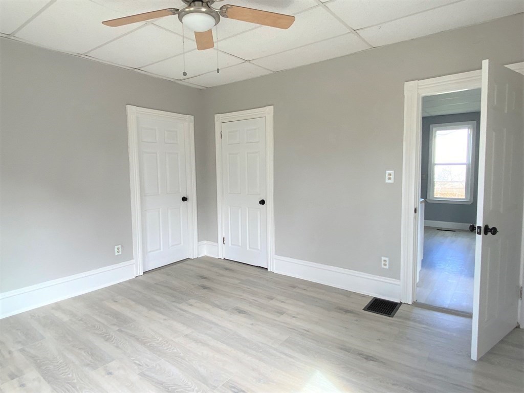 171 Snell Street Fall River, MA 02721 - Photo 16 of 34 wooden floor in an empty room with a window