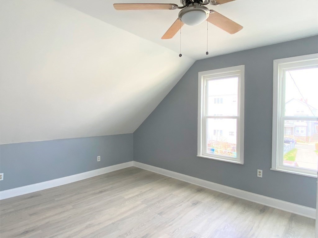 171 Snell Street Fall River, MA 02721 - Photo 18 of 34 an empty room with a window and a ceiling fan