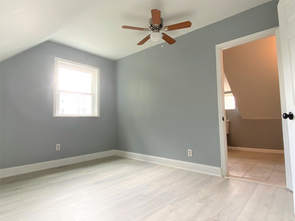 171 Snell Street Fall River, MA 02721 - Photo 21 of 34 an empty room with a window and a fan