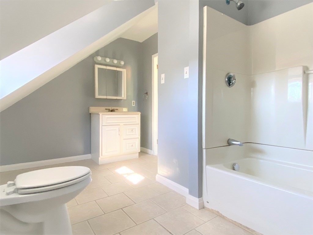 171 Snell Street Fall River, MA 02721 - Photo 23 of 34 a bathroom with a toilet sink and mirror