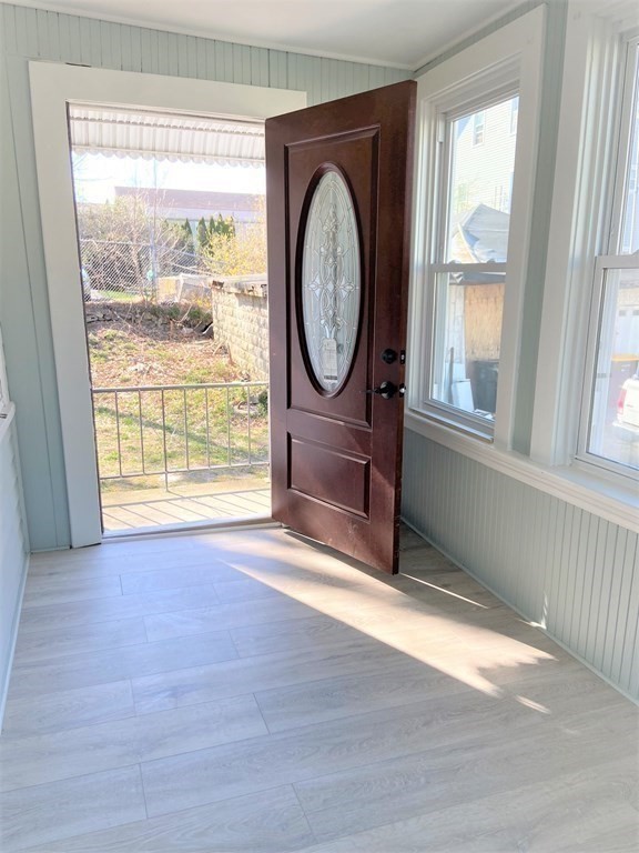 171 Snell Street Fall River, MA 02721 - Photo 24 of 34 an empty room with wooden floor and windows