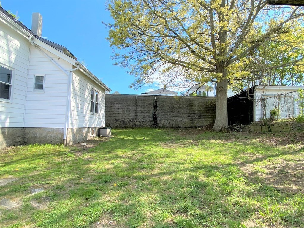 171 Snell Street Fall River, MA 02721 - Photo 30 of 34 a view of a backyard with large tree