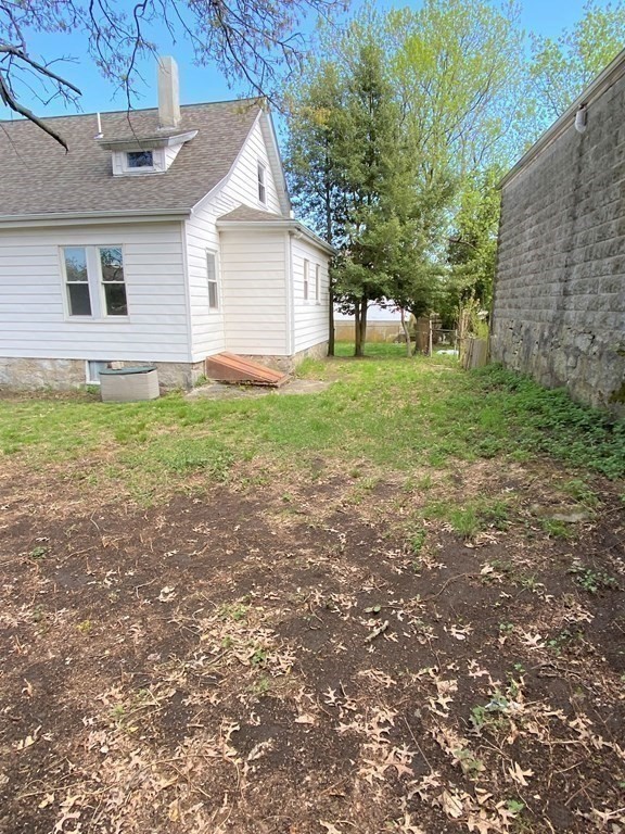 171 Snell Street Fall River, MA 02721 - Photo 31 of 34 a view of a house with yard and a tree
