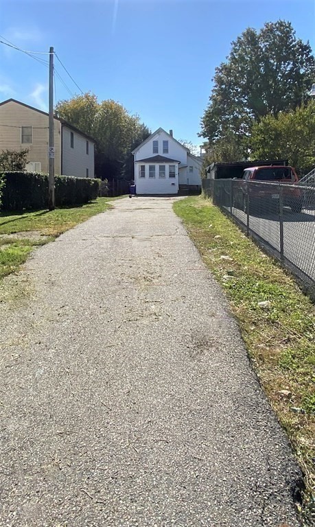 171 Snell Street Fall River, MA 02721 - Photo 32 of 34 a view of a house with a yard