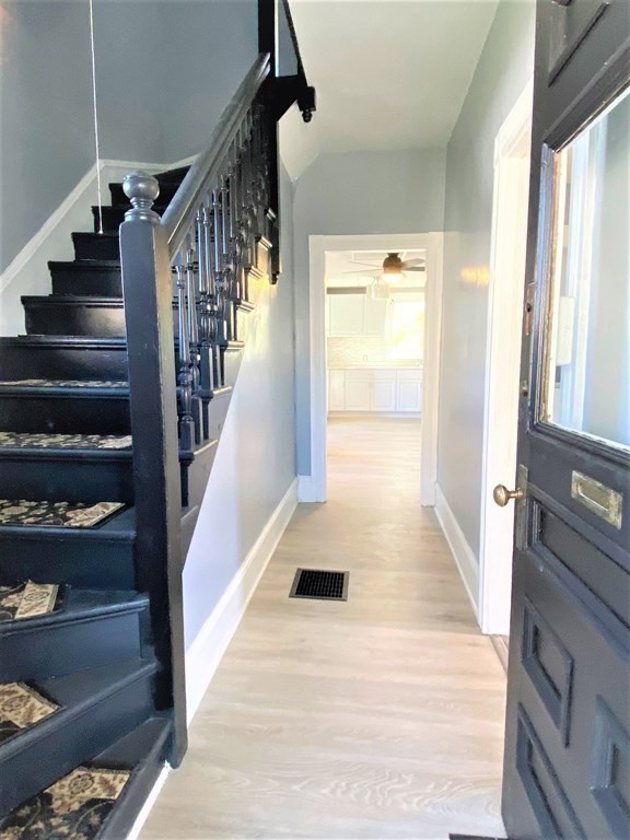 171 Snell Street Fall River, MA 02721 - Photo 6 of 34 a view of staircase with lots of frames on wall and a window