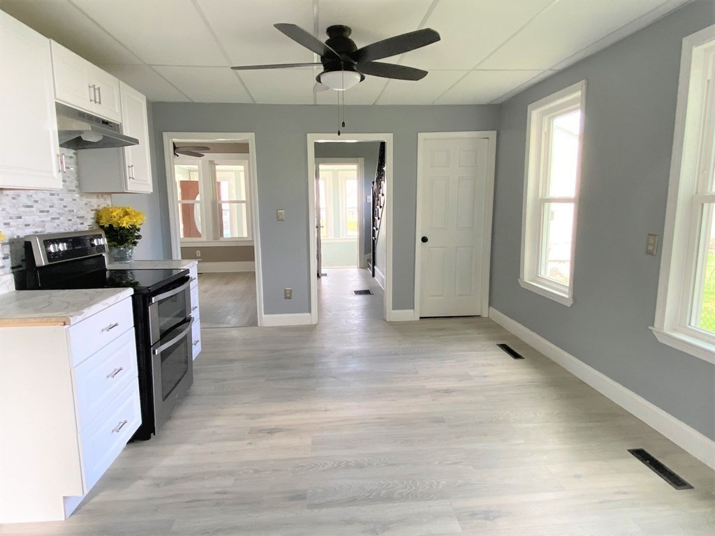 171 Snell Street Fall River, MA 02721 - Photo 10 of 34 a view of a kitchen cabinets and a stove top oven