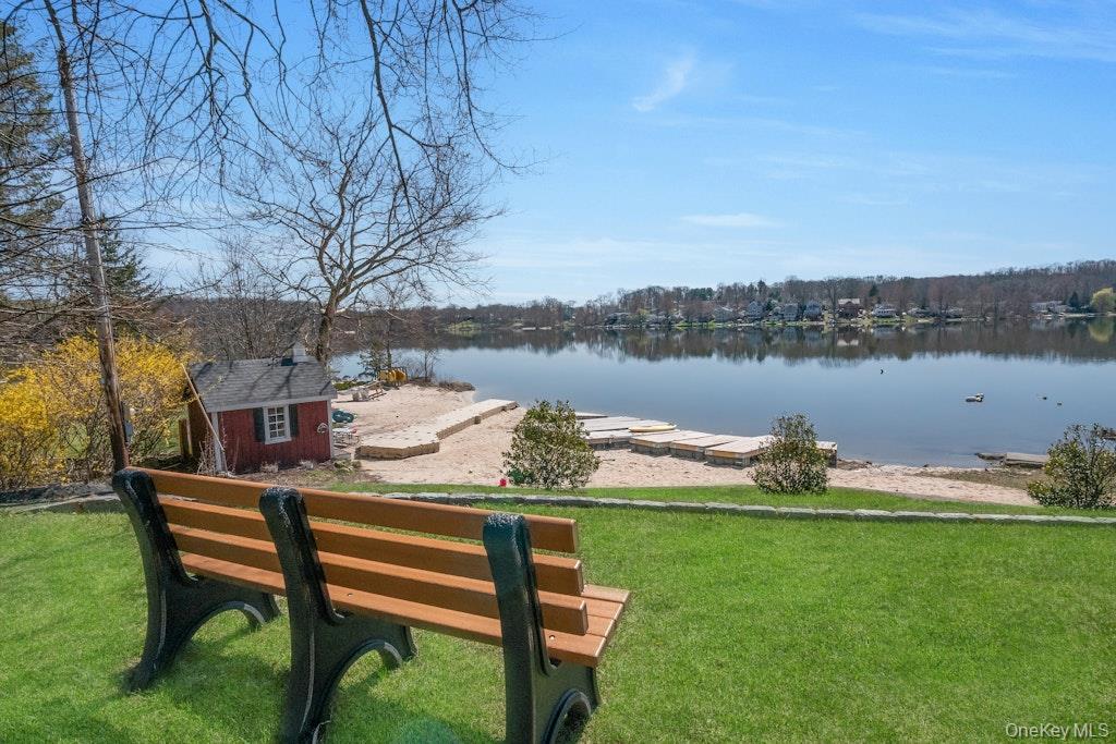 10 Locust Road Brewster, NY 10509 - Photo 17 of 21 a backyard of a house with table and chairs