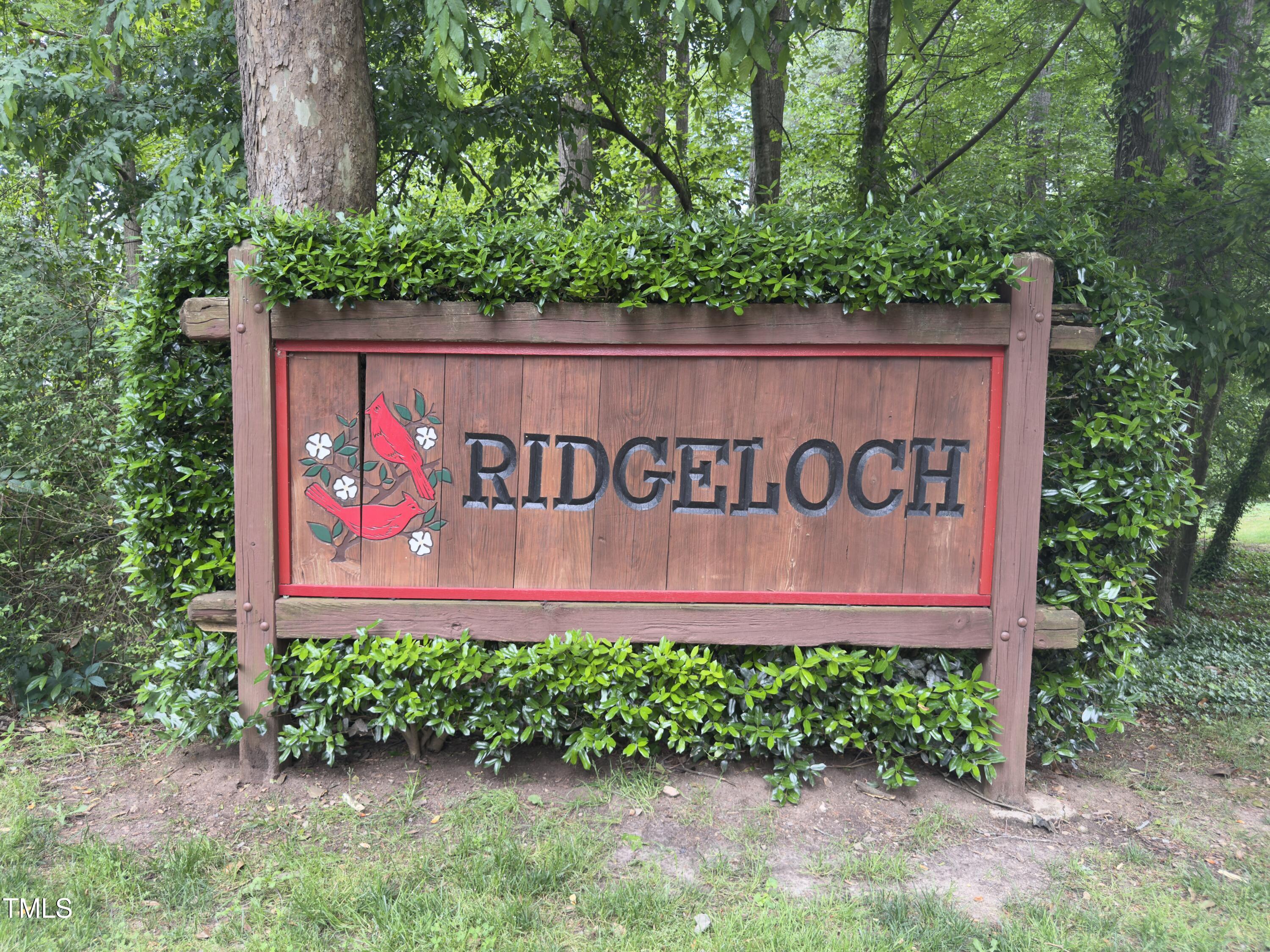 5767 Forest Lawn Court Raleigh, NC 27612 - Photo 12 of 17 a sign on the wooden wall