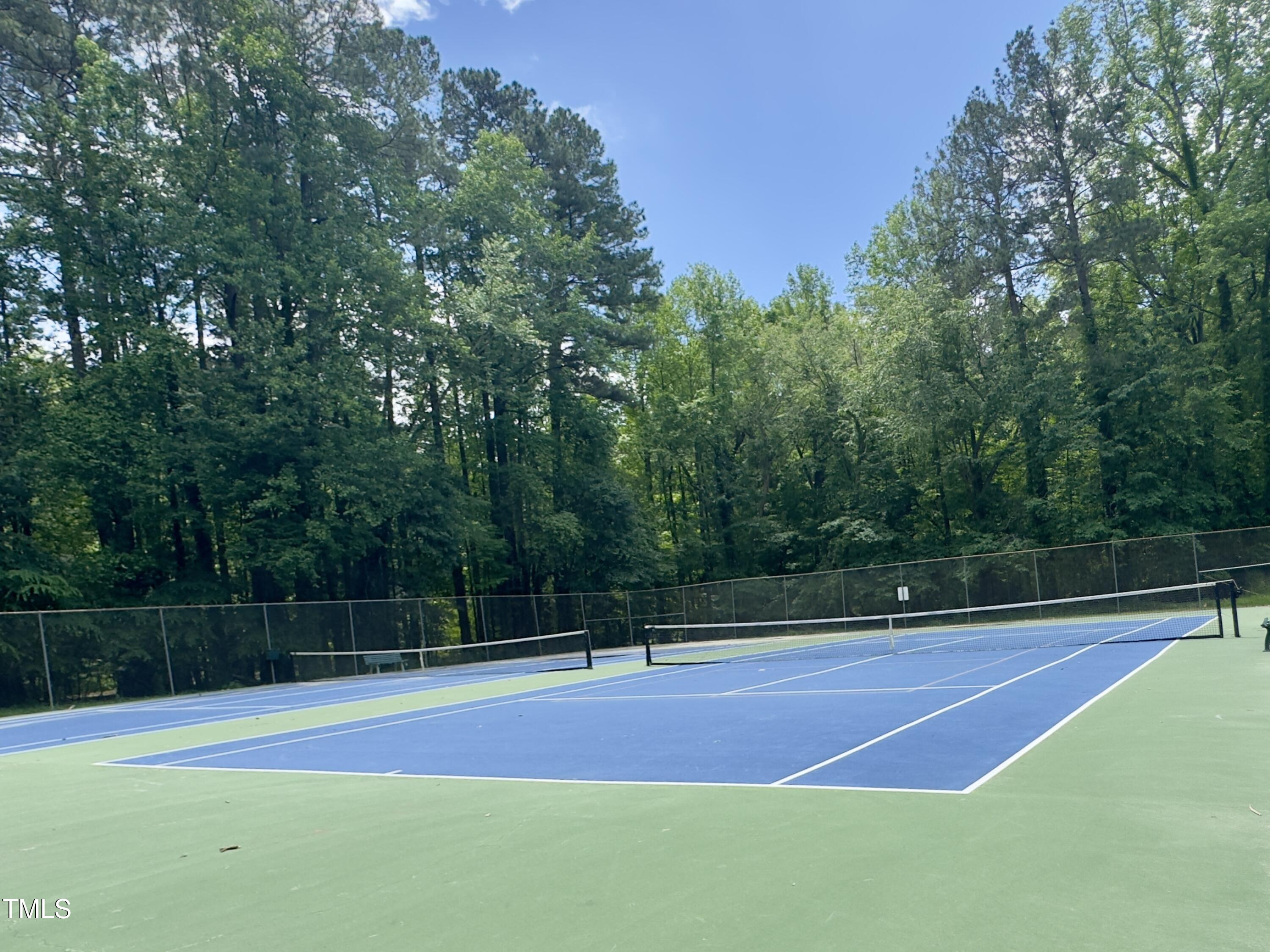 5767 Forest Lawn Court Raleigh, NC 27612 - Photo 13 of 17 a view of a tennis court