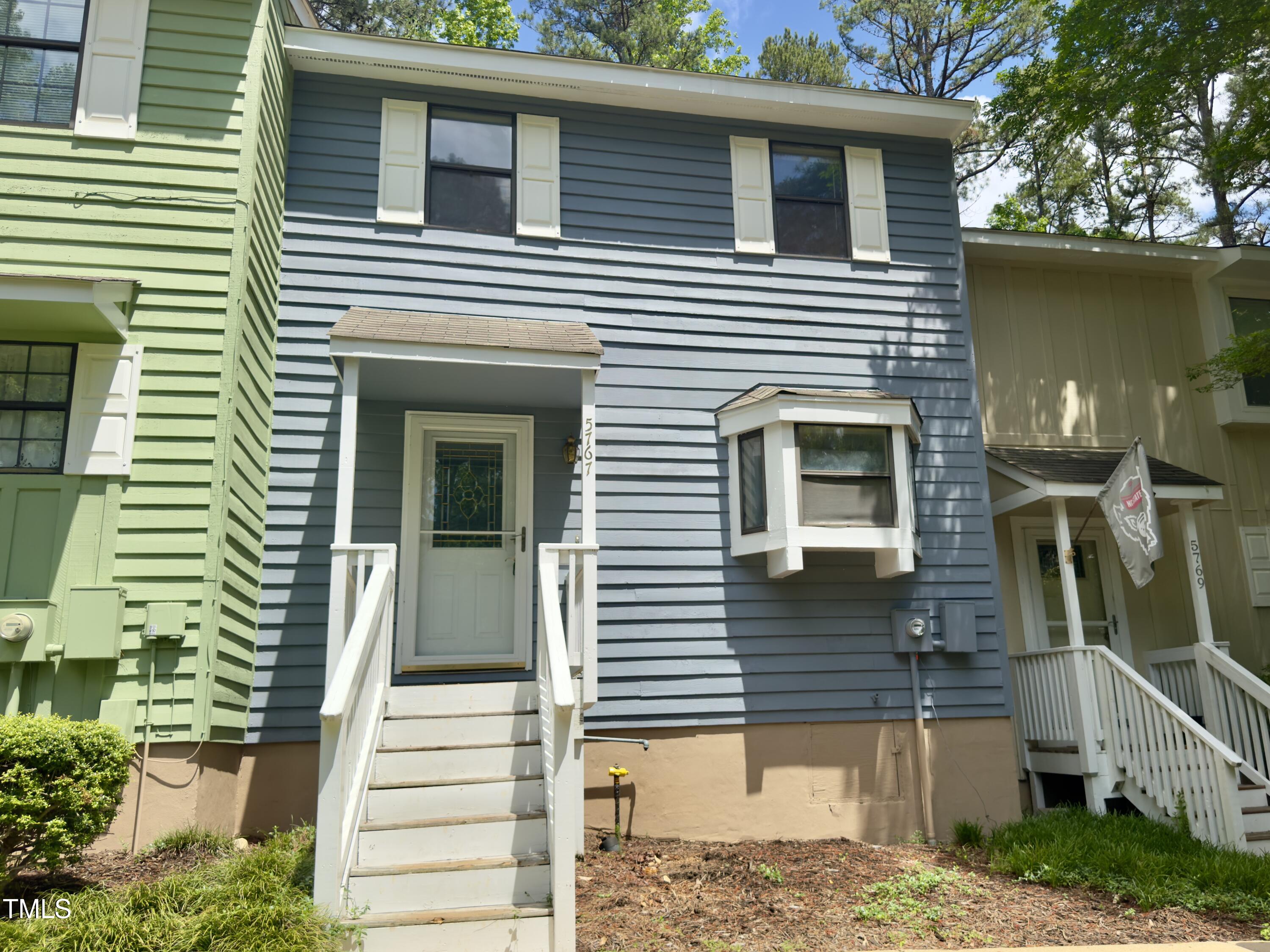 5767 Forest Lawn Court Raleigh, NC 27612 - Photo 2 of 17 a view of a house with more windows and brick walls