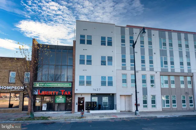 a view of a building with a street
